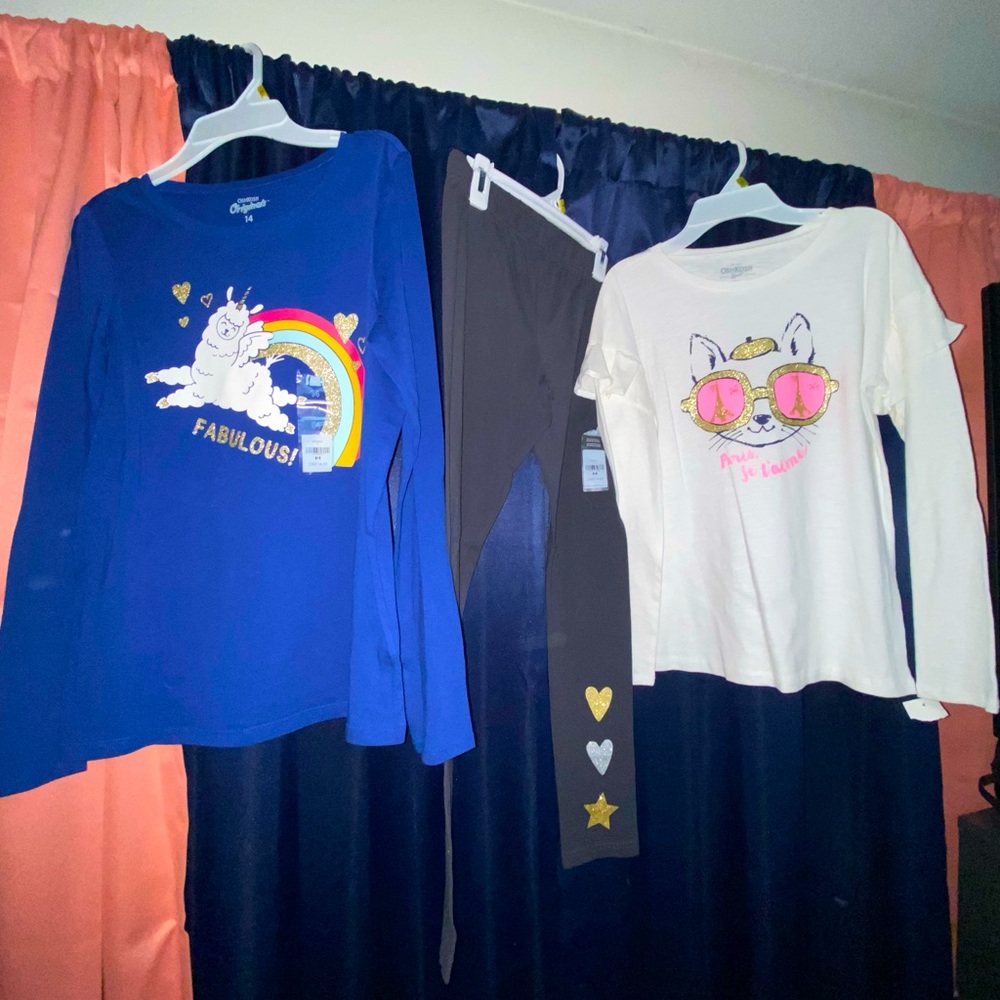 Two new long sleeved shirts with a pair of matching pants.